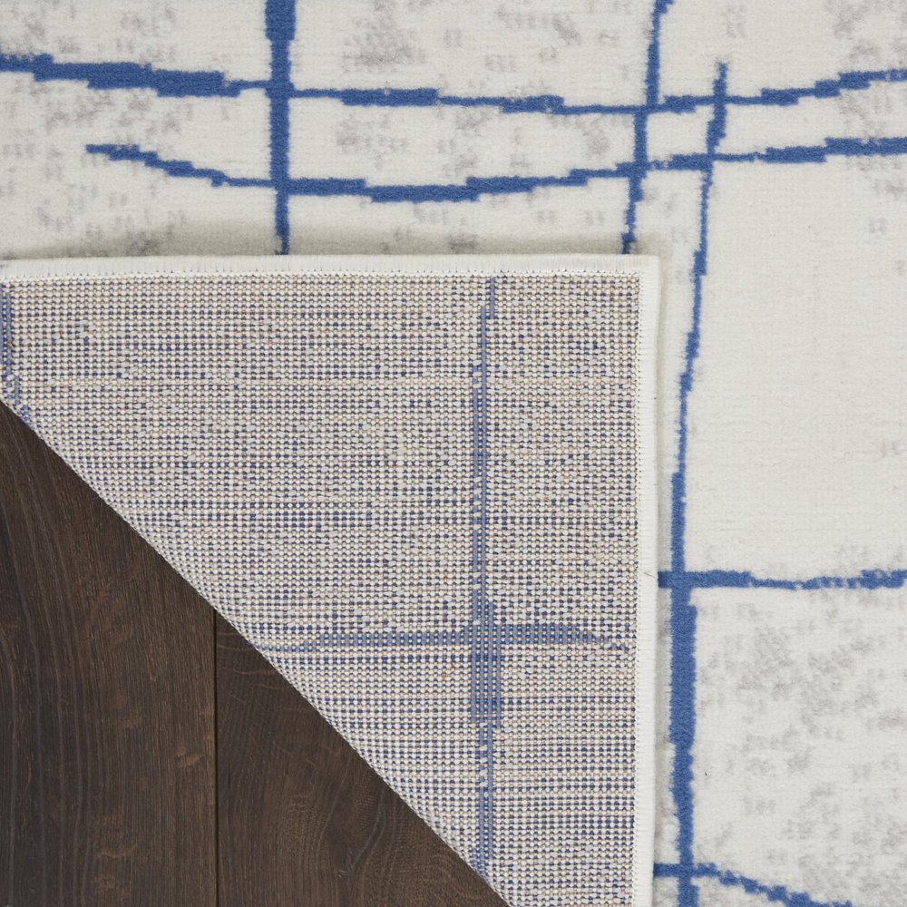 4' X 6' Ivory And Blue Geometric Distressed Area Rug