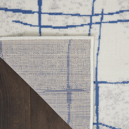 4' X 6' Ivory And Blue Geometric Distressed Area Rug