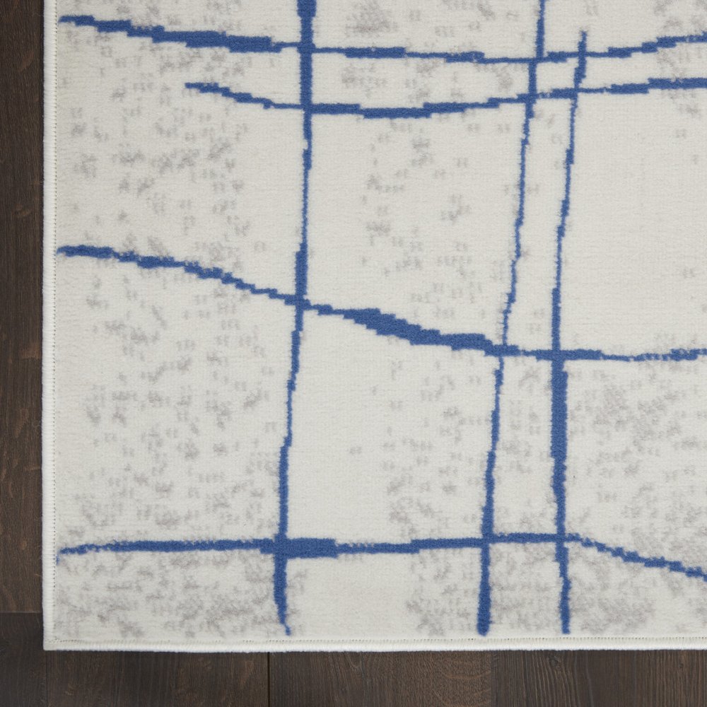 6' X 9' Ivory And Blue Geometric Distressed Area Rug