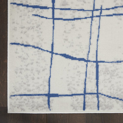 6' X 9' Ivory And Blue Geometric Distressed Area Rug