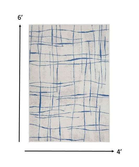 5' X 7' Blue And Ivory Abstract Dhurrie Area Rug