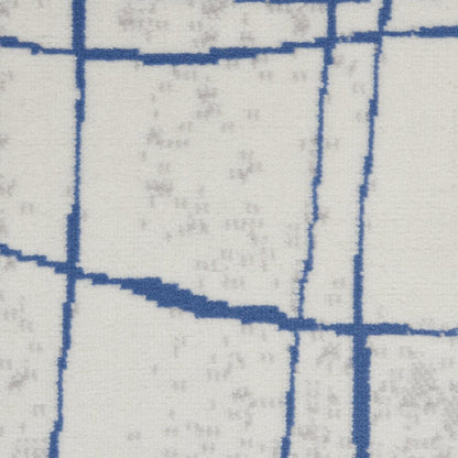 6' X 9' Ivory And Blue Geometric Distressed Area Rug