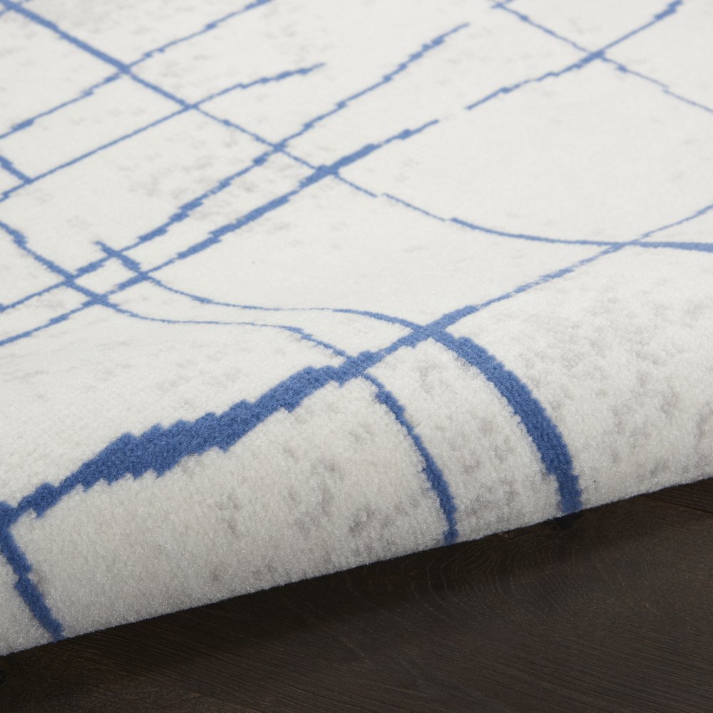6' X 9' Ivory And Blue Geometric Distressed Area Rug