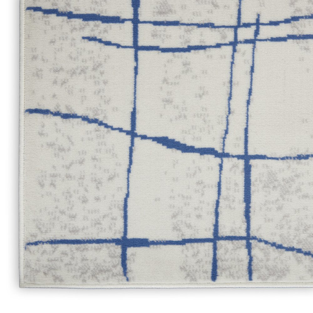 6' X 9' Ivory And Blue Geometric Distressed Area Rug