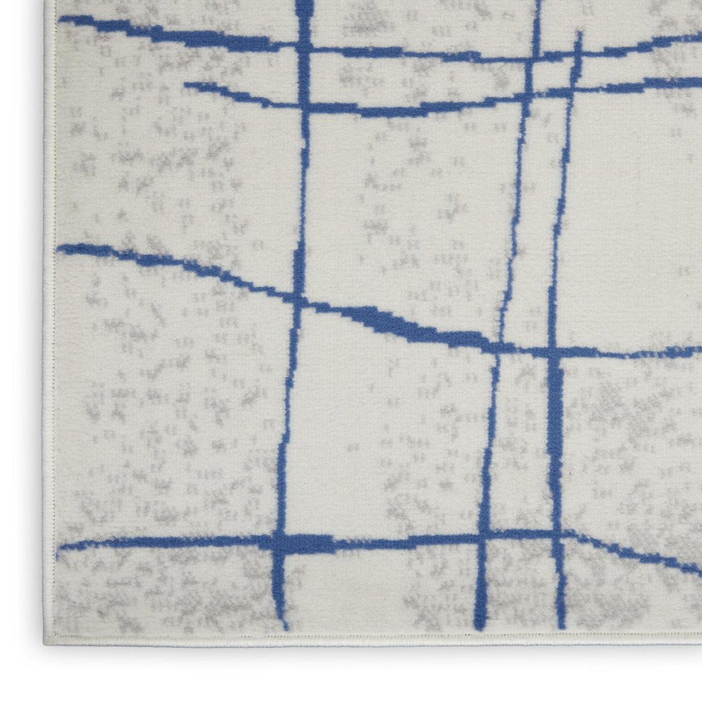 6' X 9' Ivory And Blue Geometric Distressed Area Rug