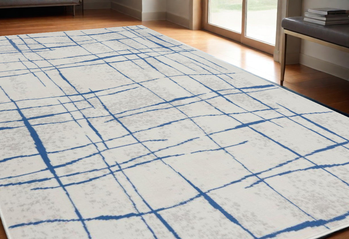 4' X 6' Blue And Ivory Abstract Dhurrie Area Rug