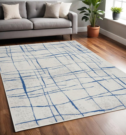 4' X 6' Ivory And Blue Geometric Distressed Area Rug