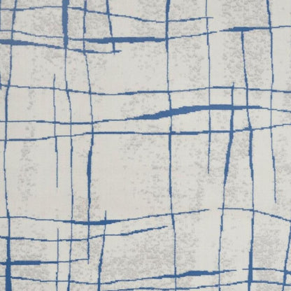 6' X 9' Ivory And Blue Geometric Distressed Area Rug