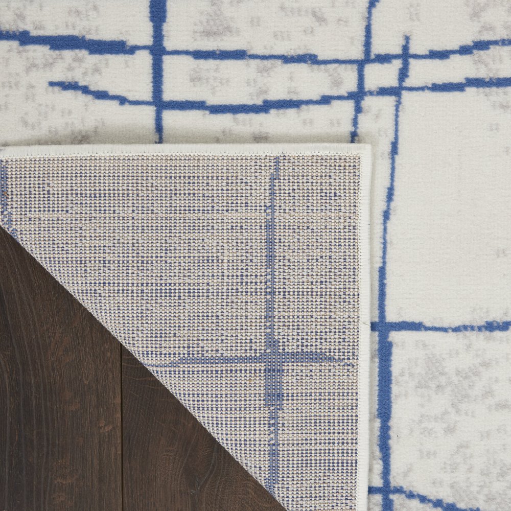 6' X 9' Ivory And Blue Geometric Distressed Area Rug