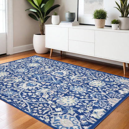 5' X 7' Ivory And Blue Floral Area Rug