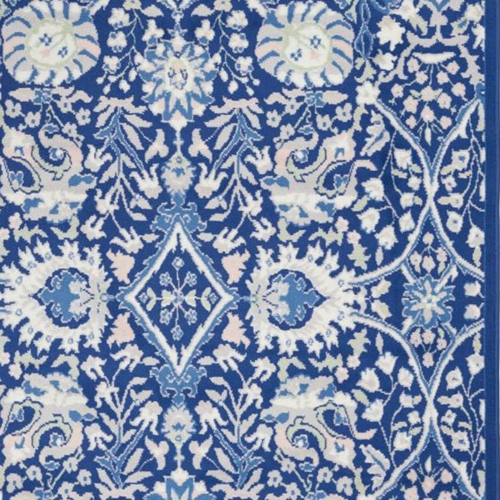 5' X 7' Ivory And Blue Floral Area Rug