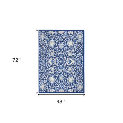 5' X 7' Ivory And Blue Floral Area Rug
