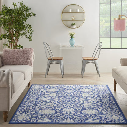 5' X 7' Ivory And Blue Floral Area Rug