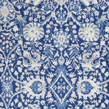 6' X 9' Blue And Ivory Floral Area Rug
