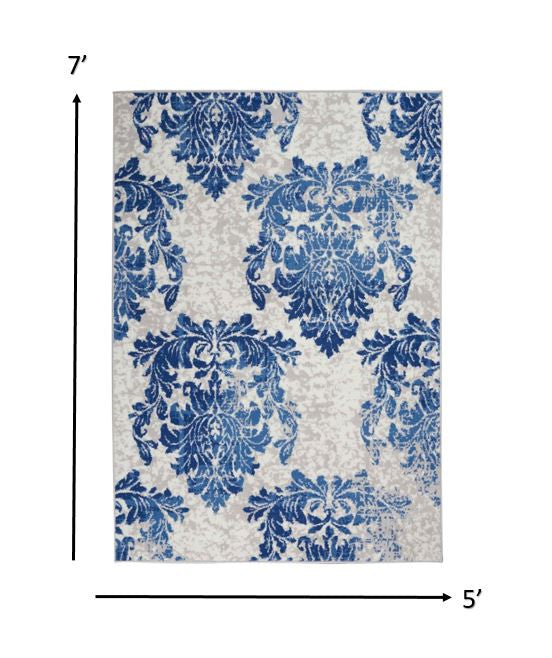 6' X 9' Blue And Ivory Floral Dhurrie Area Rug