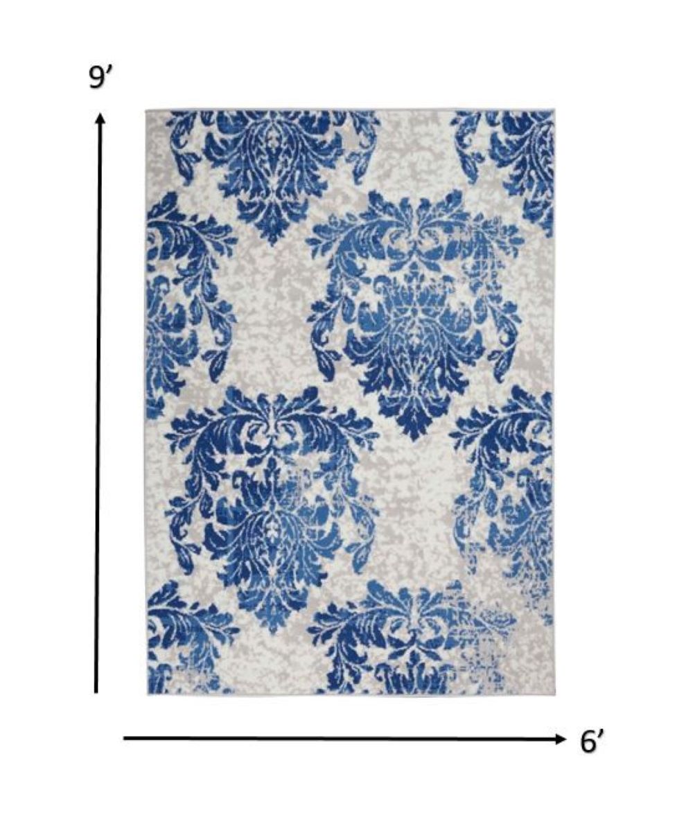 6' X 9' Blue And Ivory Floral Dhurrie Area Rug