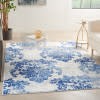 6' X 9' Blue And Ivory Floral Dhurrie Area Rug