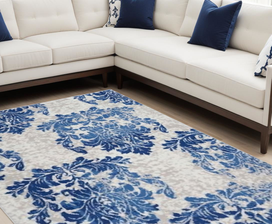 6' X 9' Blue And Ivory Floral Dhurrie Area Rug