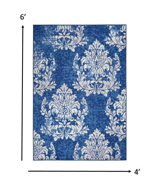 6' X 9' Blue And Ivory Floral Dhurrie Area Rug