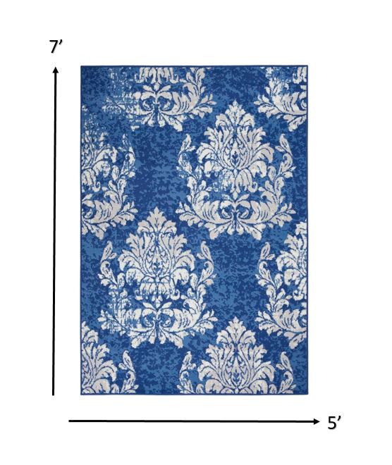 6' X 9' Blue And Ivory Floral Dhurrie Area Rug