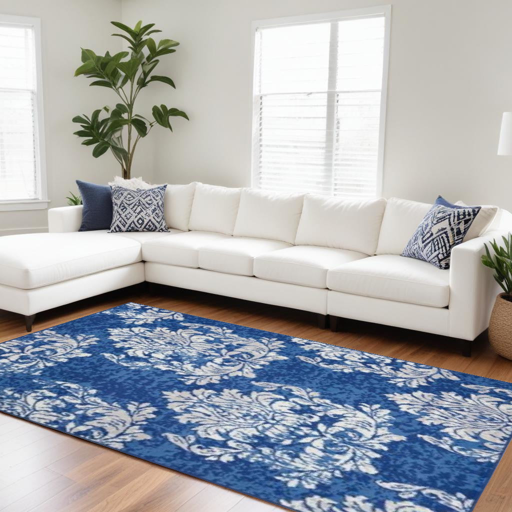 6' X 9' Ivory And Blue Damask Distressed Area Rug