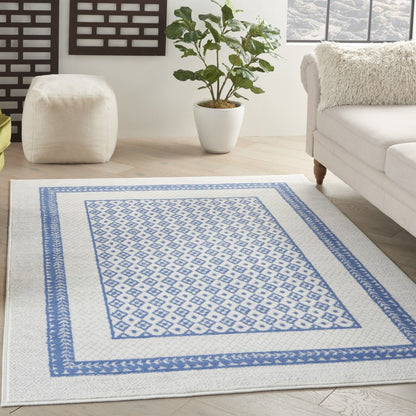 6' X 9' Ivory And Blue Geometric Area Rug