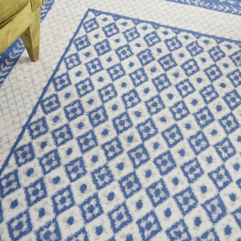 6' X 9' Ivory And Blue Geometric Area Rug