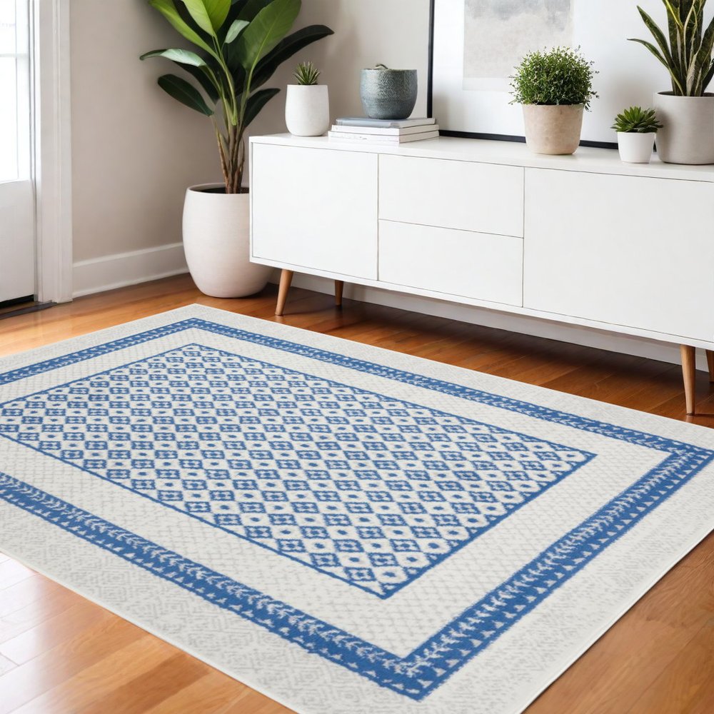 6' X 9' Ivory And Blue Geometric Area Rug