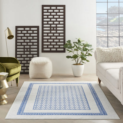 5' X 7' Ivory And Blue Geometric Area Rug