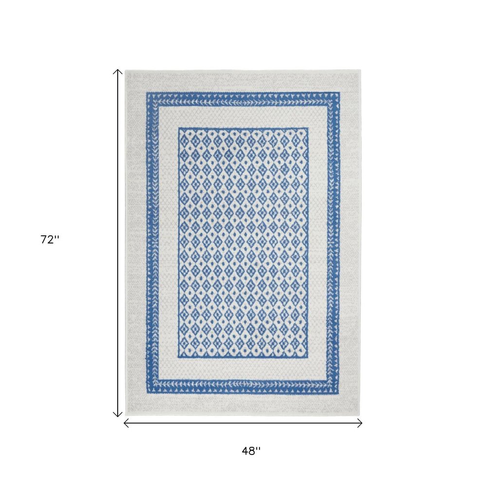 5' X 7' Ivory And Blue Geometric Area Rug
