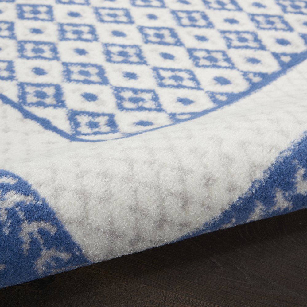 6' X 9' Ivory And Blue Geometric Area Rug