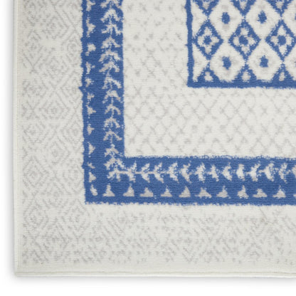 5' X 7' Ivory And Blue Geometric Area Rug