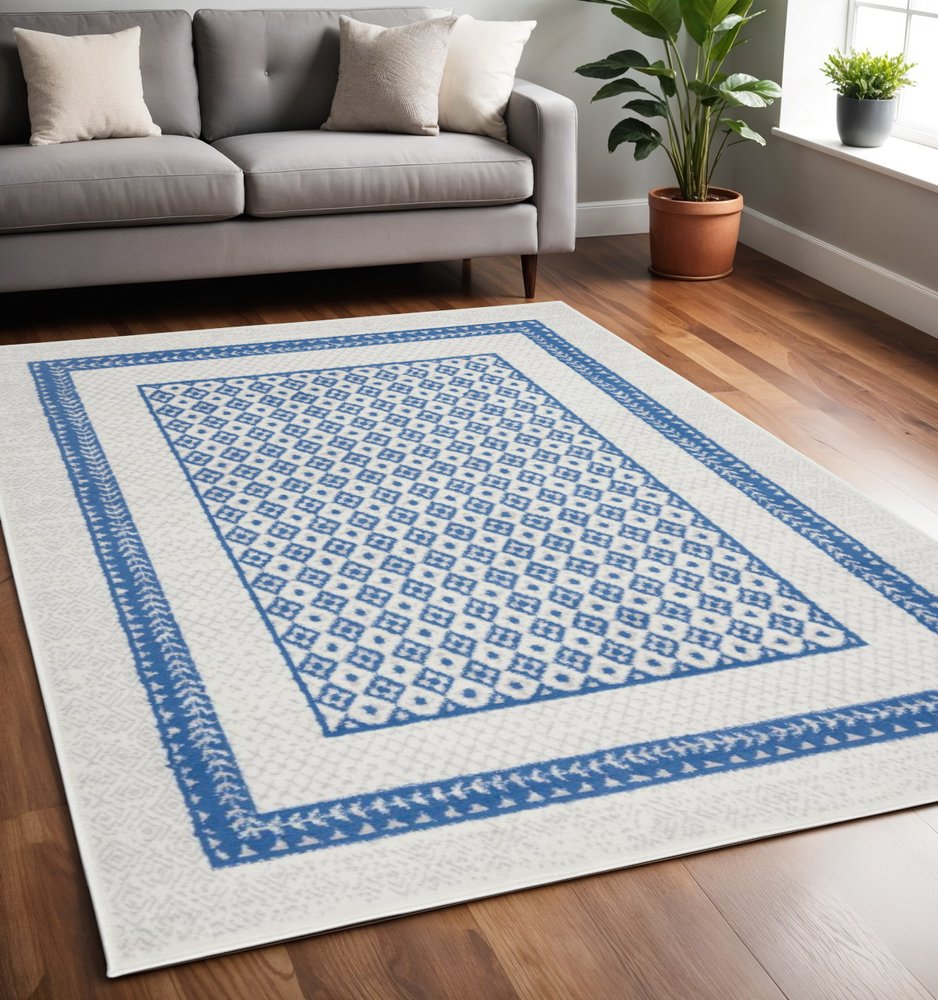6' X 9' Ivory And Blue Geometric Area Rug