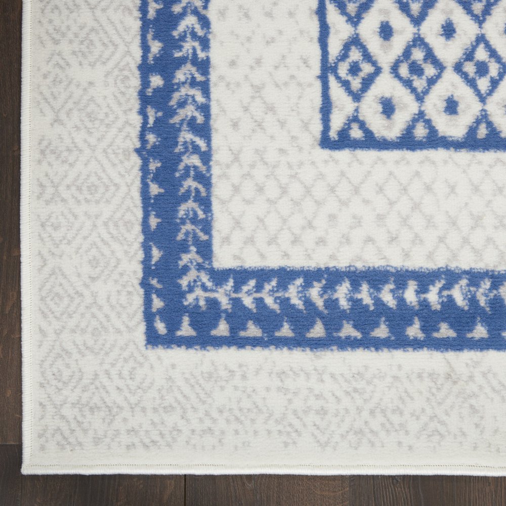6' X 9' Ivory And Blue Geometric Area Rug