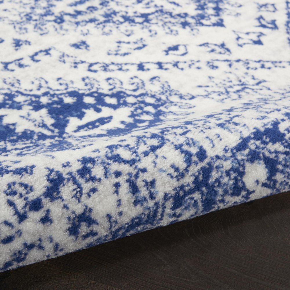 5' X 7' Ivory And Blue Geometric Distressed Area Rug