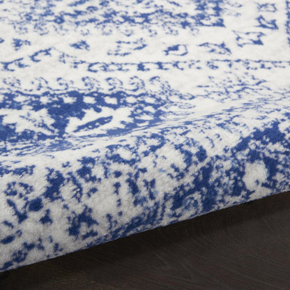 5' X 7' Ivory And Blue Geometric Distressed Area Rug