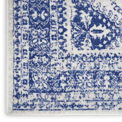 5' X 7' Ivory And Blue Geometric Distressed Area Rug