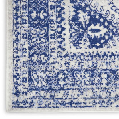 5' X 7' Ivory And Blue Geometric Distressed Area Rug