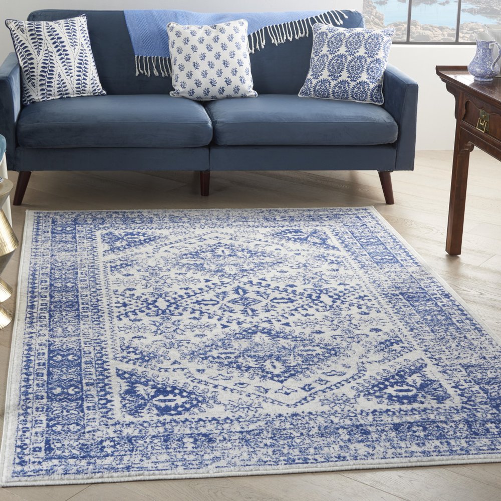 5' X 7' Ivory And Blue Geometric Distressed Area Rug