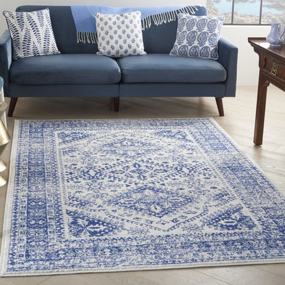 5' X 7' Ivory And Blue Geometric Distressed Area Rug