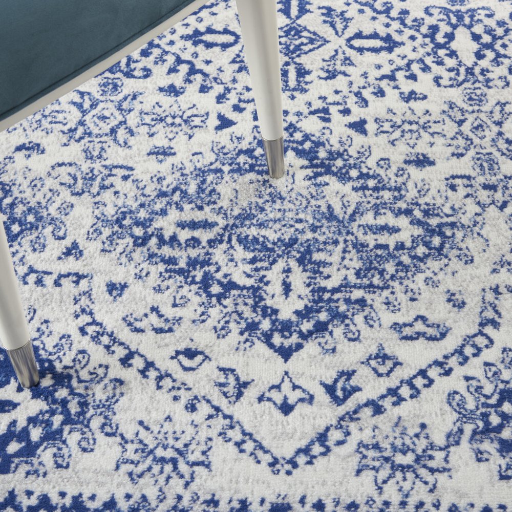 5' X 7' Ivory And Blue Geometric Distressed Area Rug