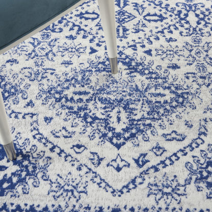 5' X 7' Ivory And Blue Geometric Distressed Area Rug