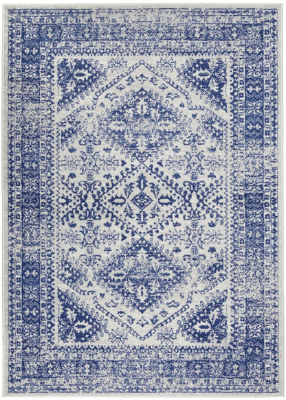 5' X 7' Ivory And Blue Geometric Distressed Area Rug