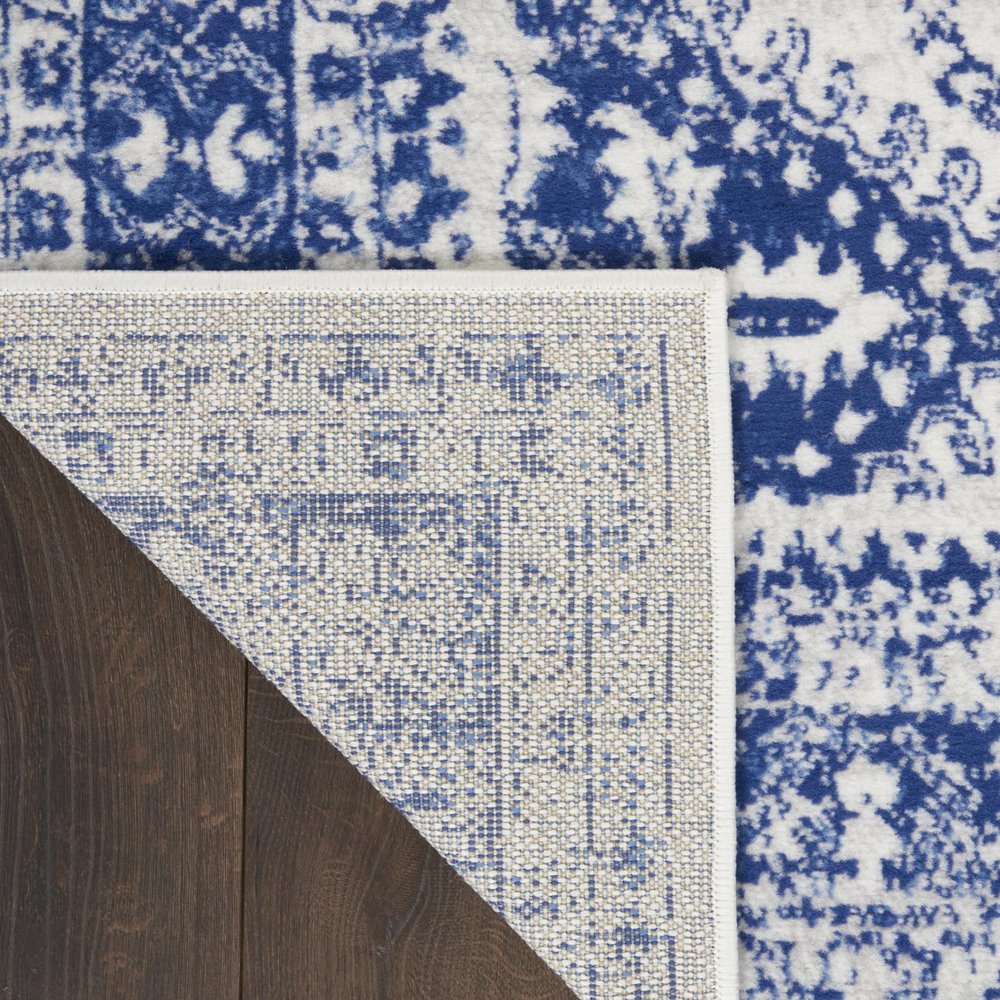 5' X 7' Ivory And Blue Geometric Distressed Area Rug