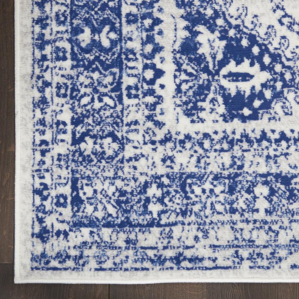 5' X 7' Ivory And Blue Geometric Distressed Area Rug
