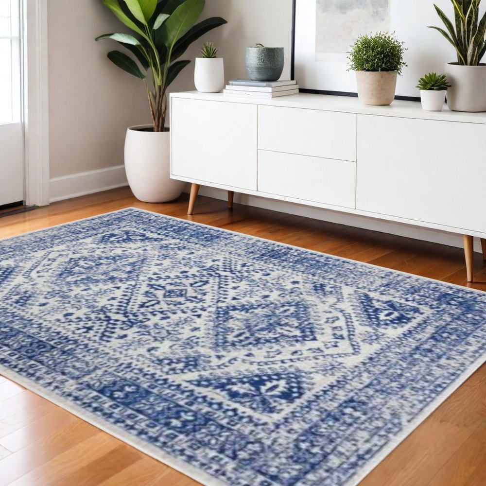 5' X 7' Ivory And Blue Geometric Distressed Area Rug