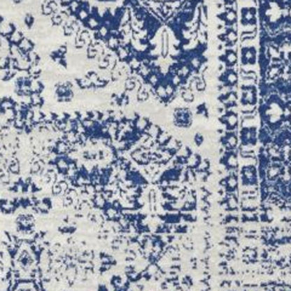 5' X 7' Ivory And Blue Geometric Distressed Area Rug