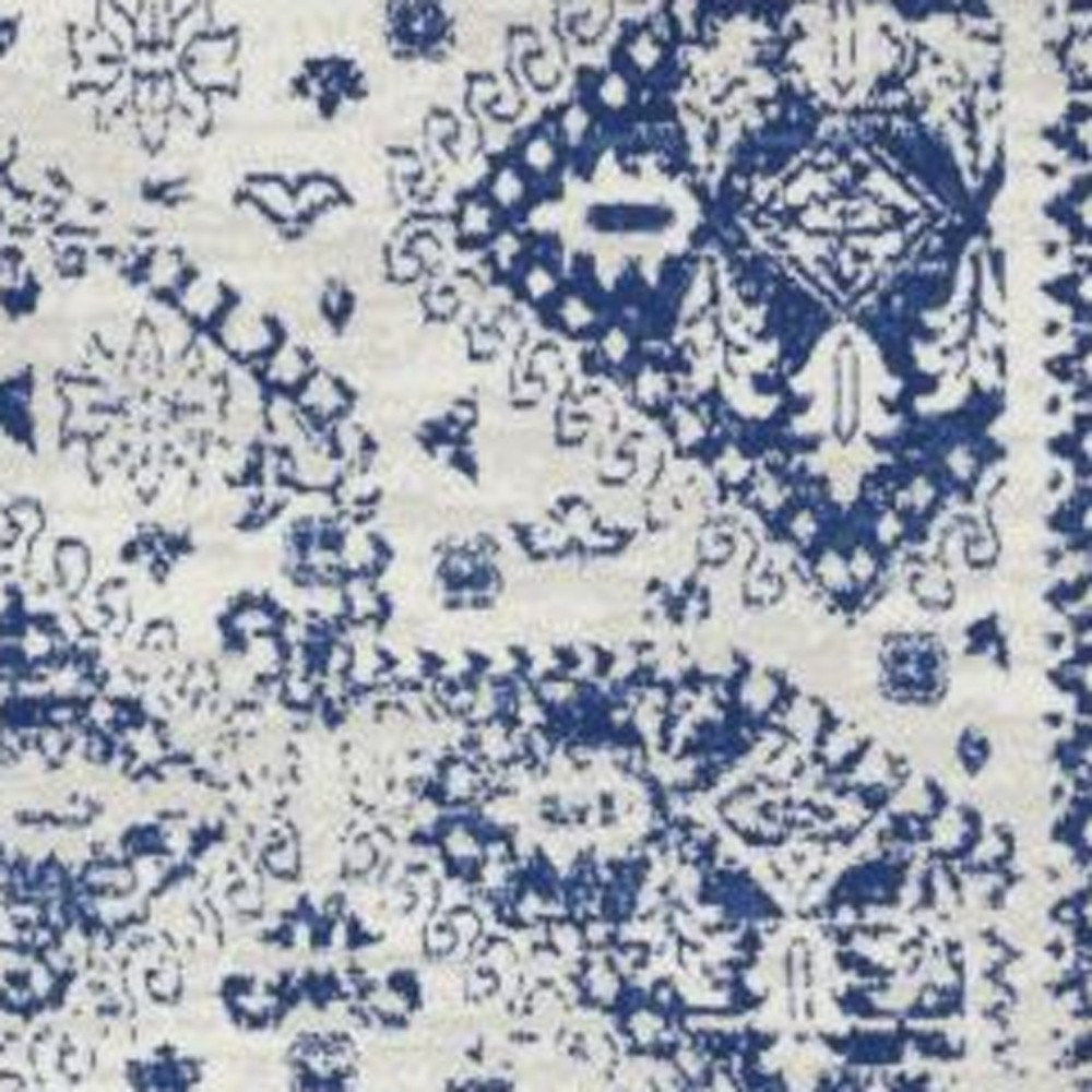 5' X 7' Ivory And Blue Geometric Distressed Area Rug
