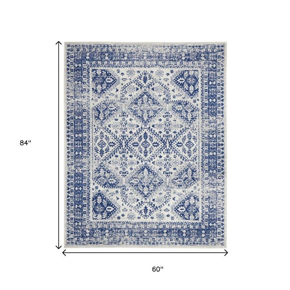 5' X 7' Ivory And Blue Geometric Distressed Area Rug