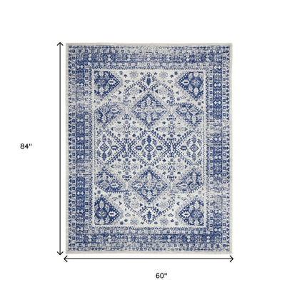 5' X 7' Ivory And Blue Geometric Distressed Area Rug